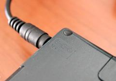 Charger polarity and voltage (12V DC) are helpfully embossed on the back